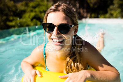 Smiling blonde with inflatable