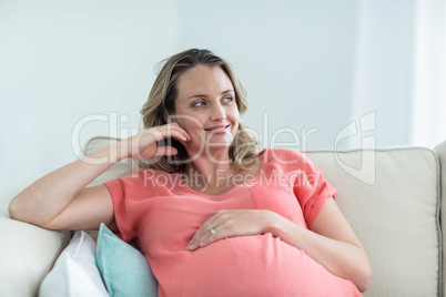 Pregnant woman touching her belly