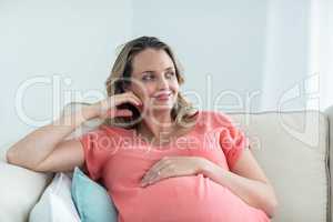 Pregnant woman touching her belly