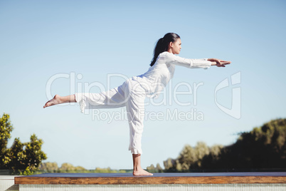 Calm brunette doing yoga