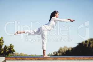 Calm brunette doing yoga