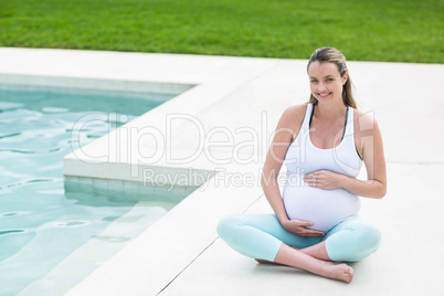 Pregnant woman touching her belly