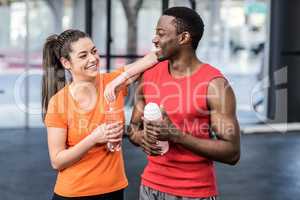 Smiling woman and man after effort