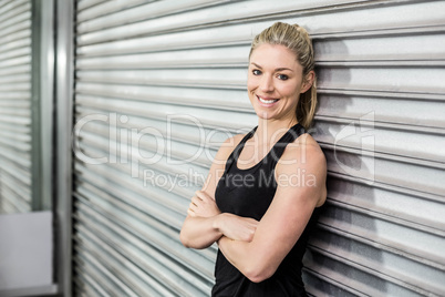 Fit woman with arm crossed