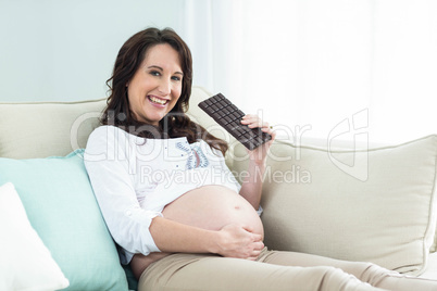 Pregnant woman eating chocolate