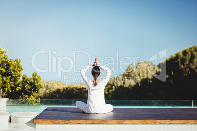 Calm brunette doing yoga