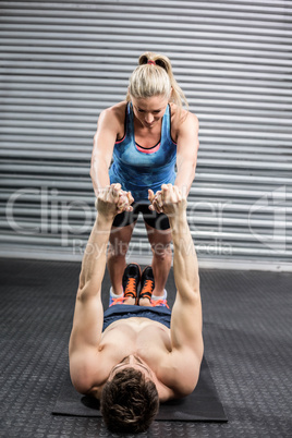 Athletic couple working out together