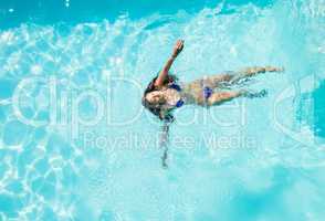 Fit woman swimming in the pool