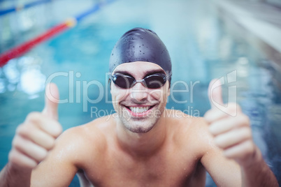 Handsome man with thumbs up