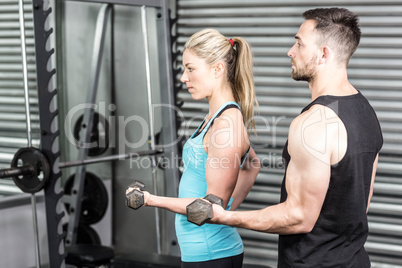 Couple posing with dumbbells