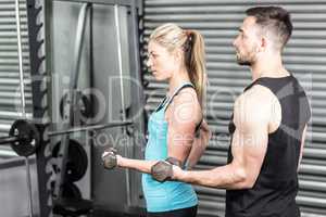 Couple posing with dumbbells