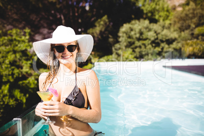 Smiling woman holding cocktail Smiling woman holding cocktail