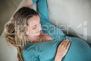 Pregnant woman touching her belly