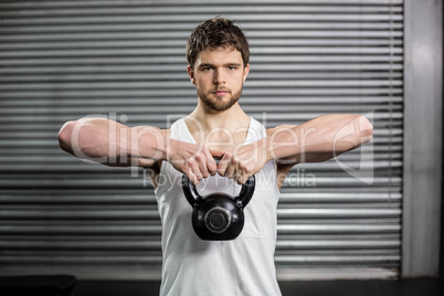 Fit man lifting a dumbbell