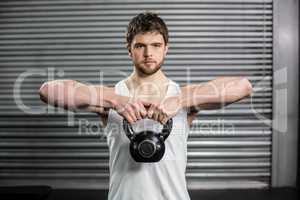 Fit man lifting a dumbbell