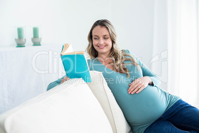 Pregnant woman reading a book