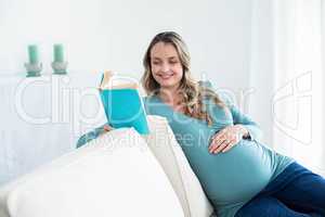 Pregnant woman reading a book