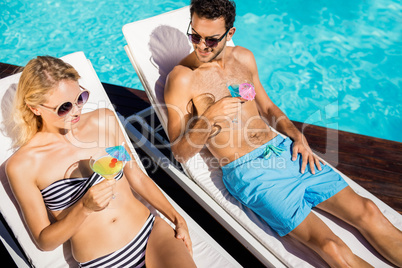 Couple relaxing on deckchairs