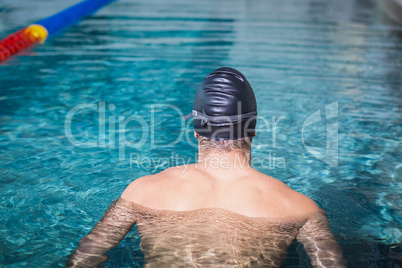 Rear view of man swimming