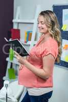 Pregnant woman reading a notebook