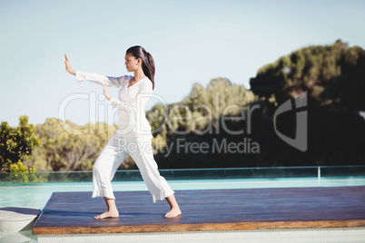 Calm brunette doing yoga