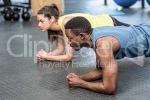 Athletic man and woman working out