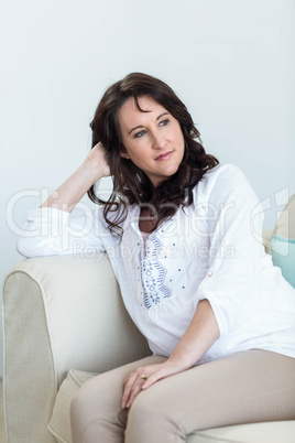 Pregnant woman sitting in the living room