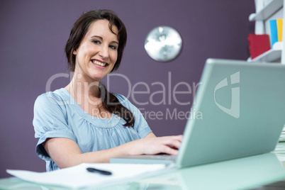 Pregnant woman on her laptop