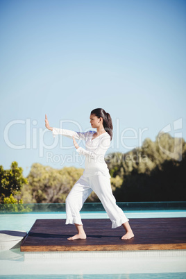 Calm brunette doing yoga