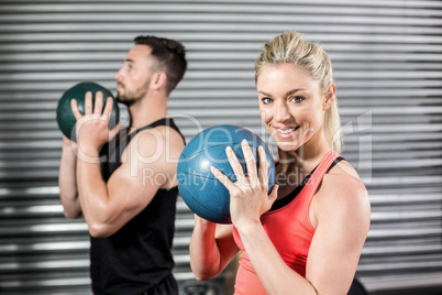 Couple doing ball exercise