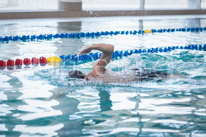 Fit man swimming