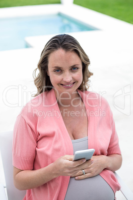 Pregnant woman texting