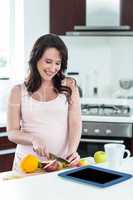 Pregnant woman preparing breakfast