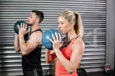 Couple doing ball exercise