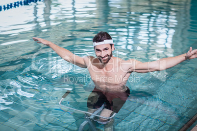 Smiling man doing underwater bike