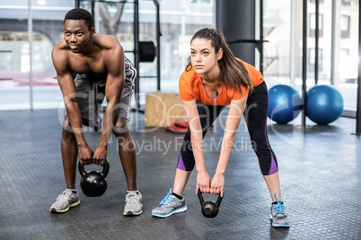 Athletic man and woman working out