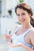 Woman holding glass of water