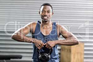 Portrait of fit man lifting dumbbells