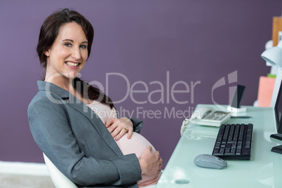 Portrait of smiling pregnant woman