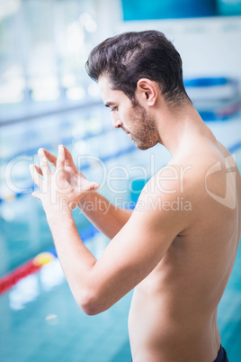 Serious man meditating with joined hands