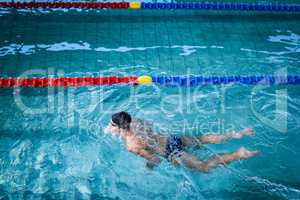 Fit man swimming