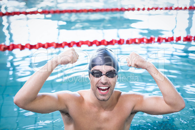 Handsome man triumphing in the water