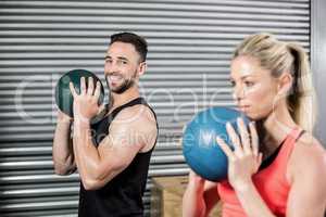 Couple doing ball exercise