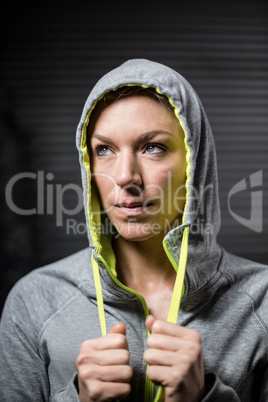 Portrait of woman wearing hood