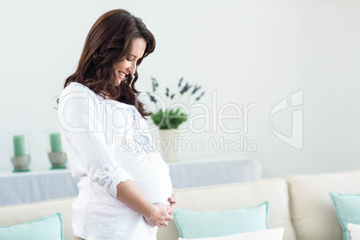 Pregnant woman in living room