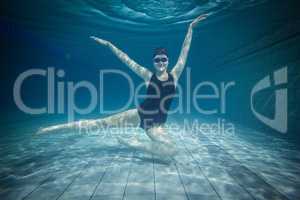 Pretty woman stretching underwater