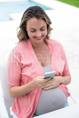 Pregnant woman texting
