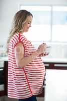 Pregnant woman eating cereals