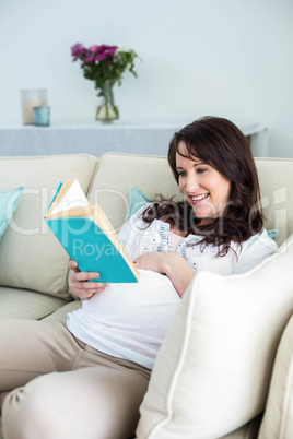 Pregnant woman reading a book