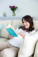 Pregnant woman reading a book